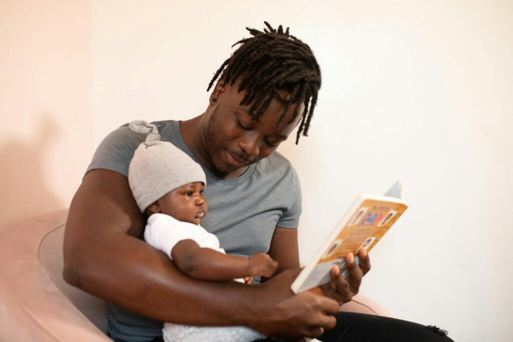 Dad reading to his baby