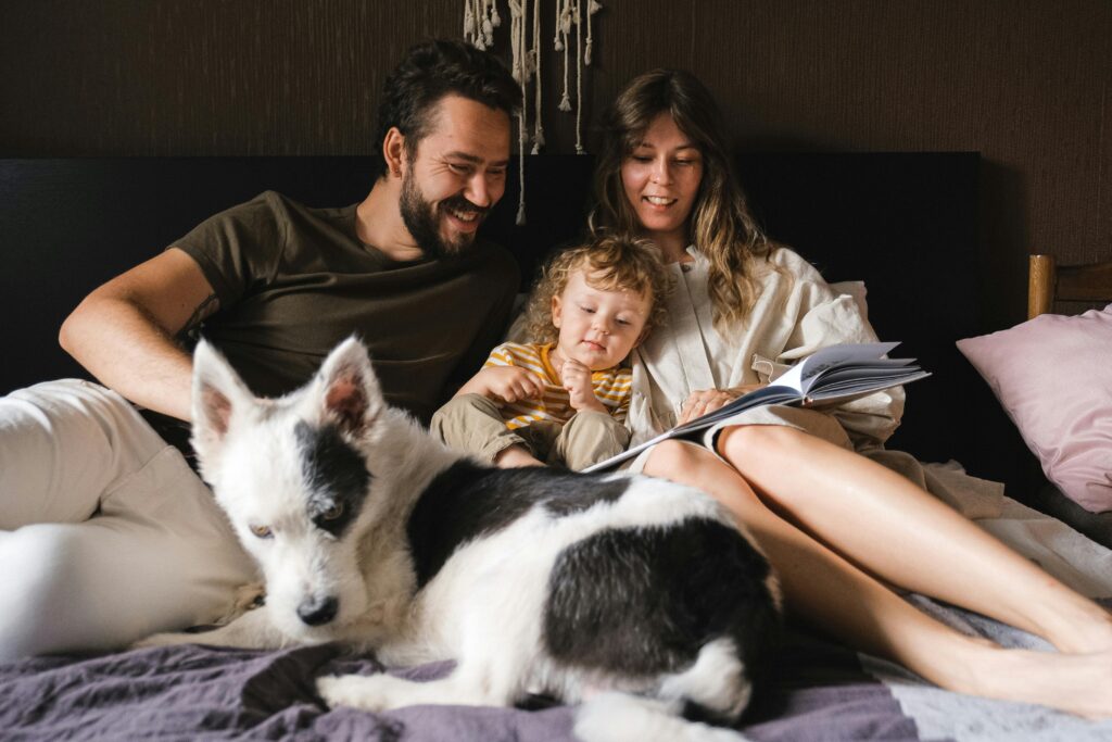 Mom and Dad reading with toddler in family storytime