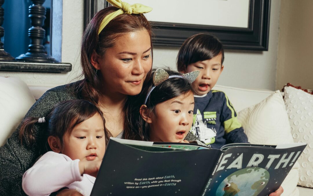 mom reading to her kids of all ages at storytime