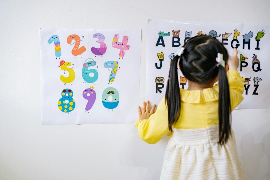 Preschool girl learning her letters and numbers