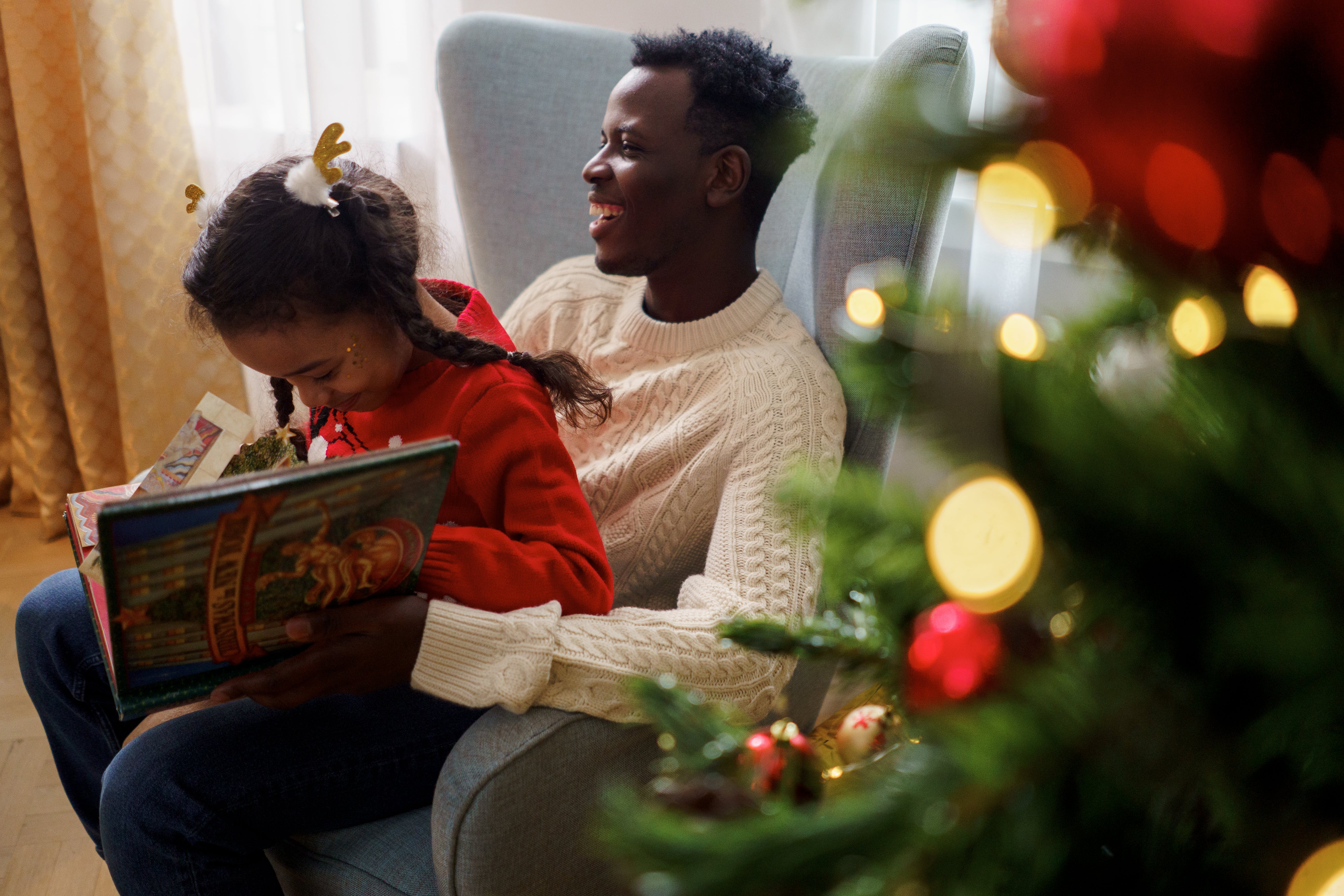 Family celebrating Christmas with books