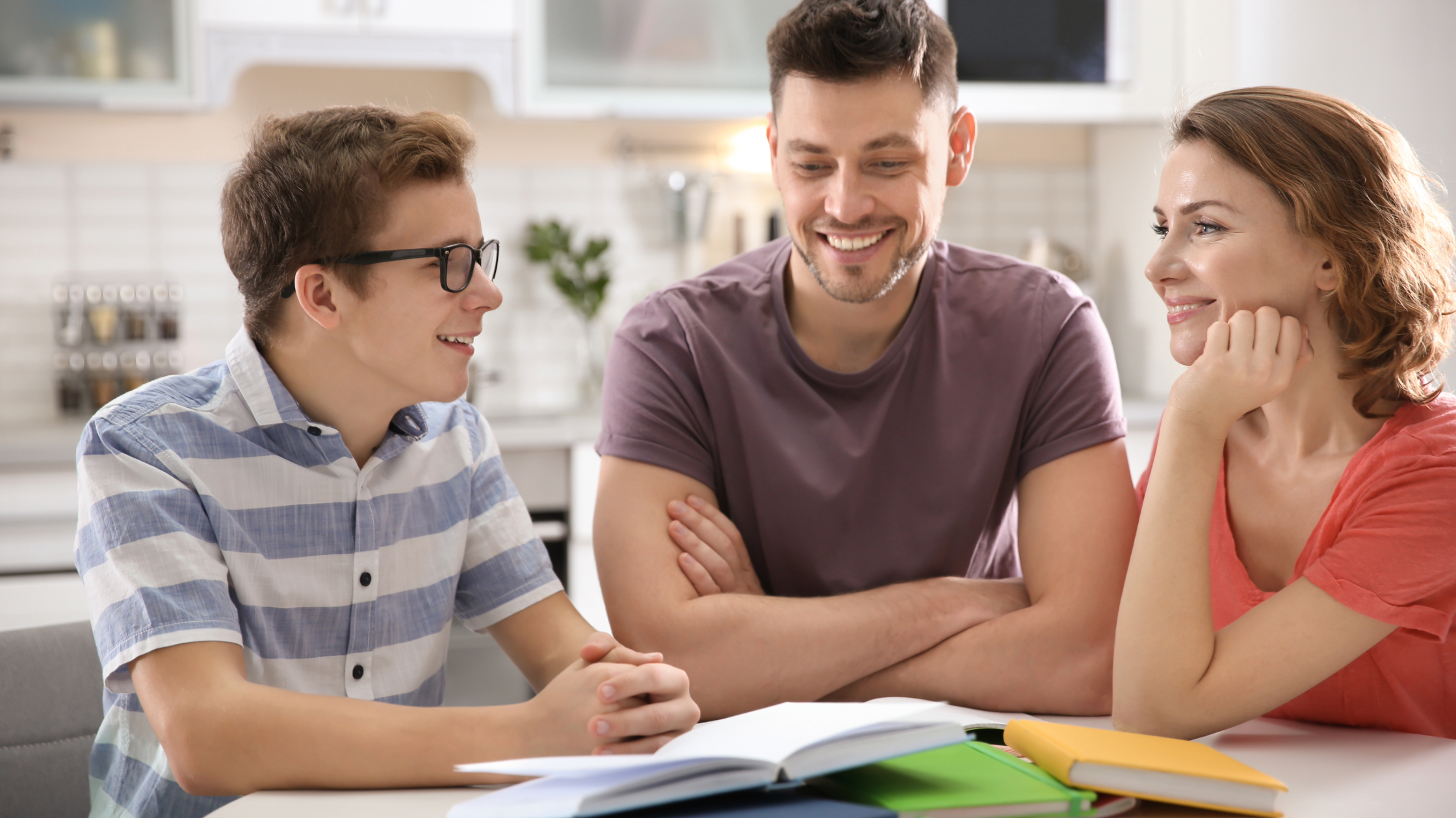 Teen boy and parents bonding over books