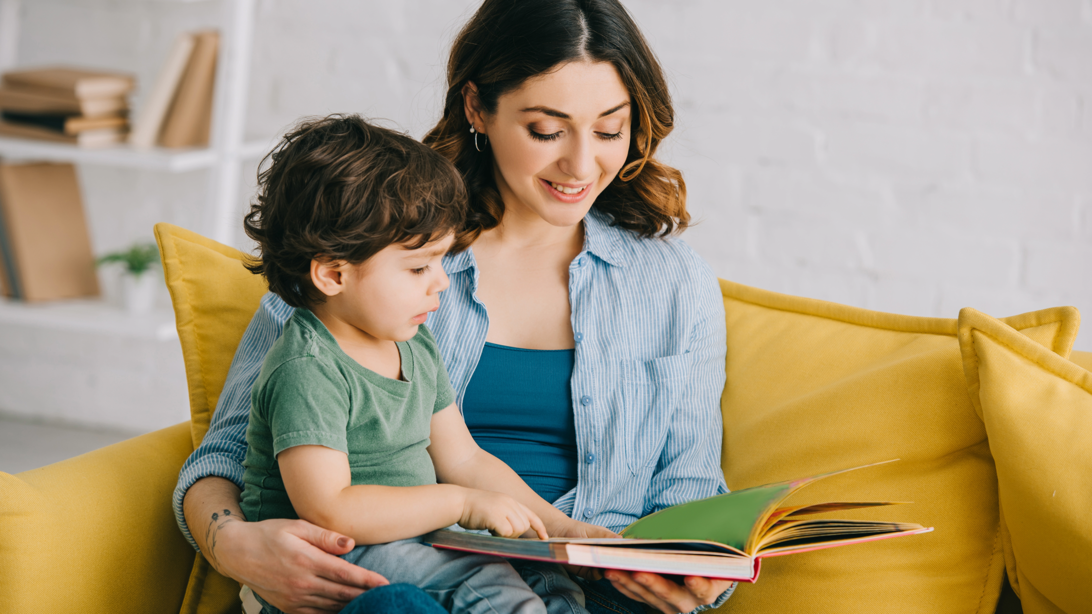 Parent reading a book to a toddler