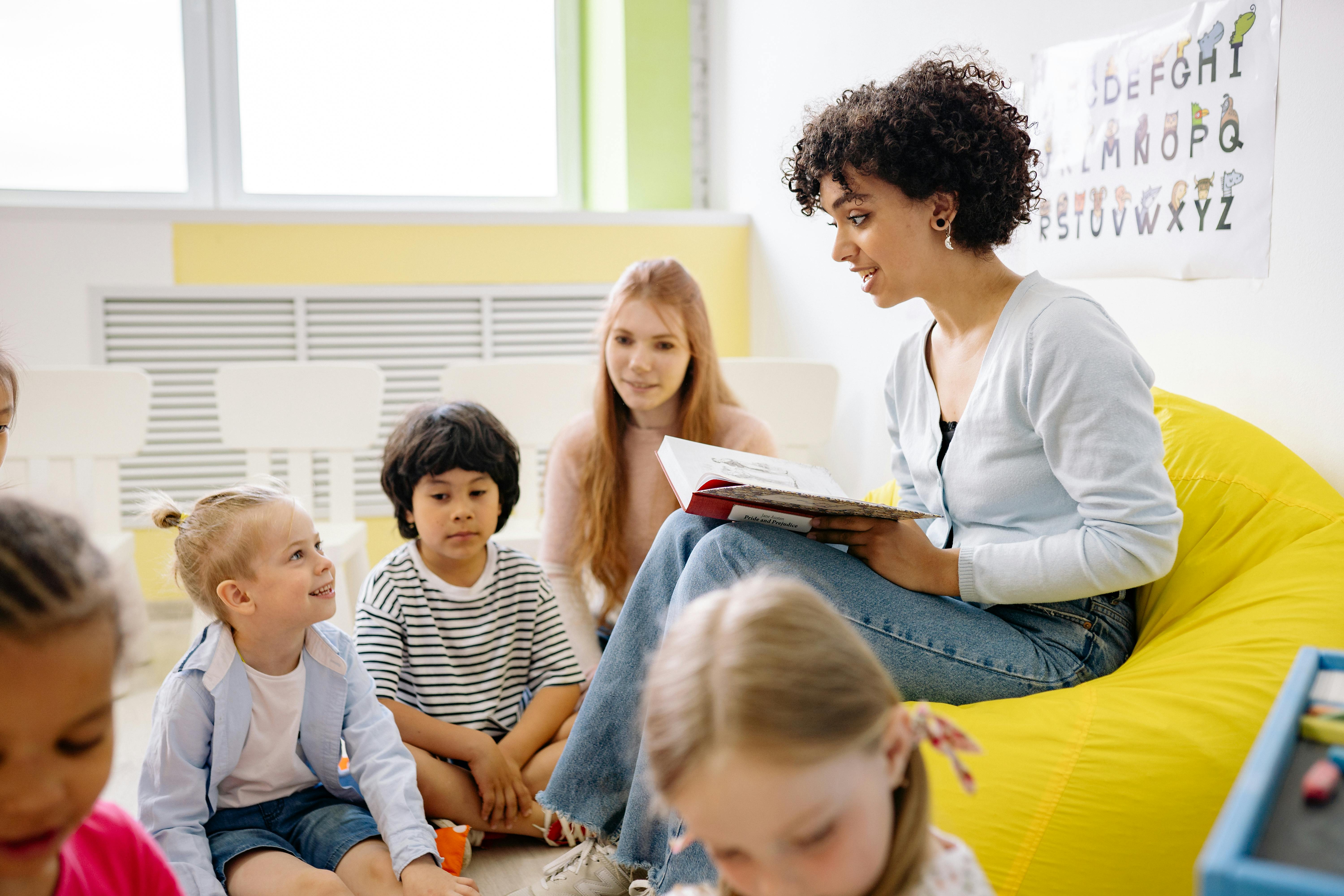 Teacher reading Bible to preschoolers